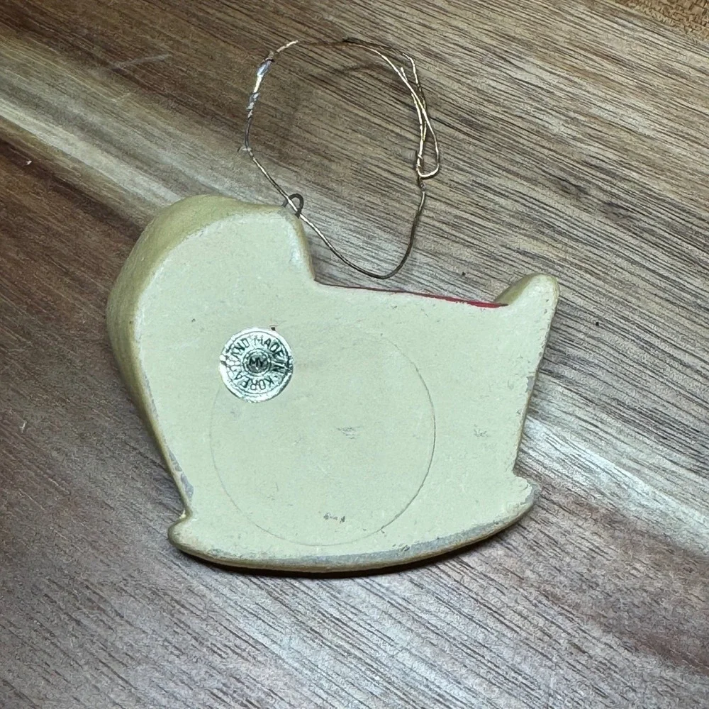 Vintage Handmade Korea Baby in Cradle Ornament Yellow Red Heart Rocking Bassinet